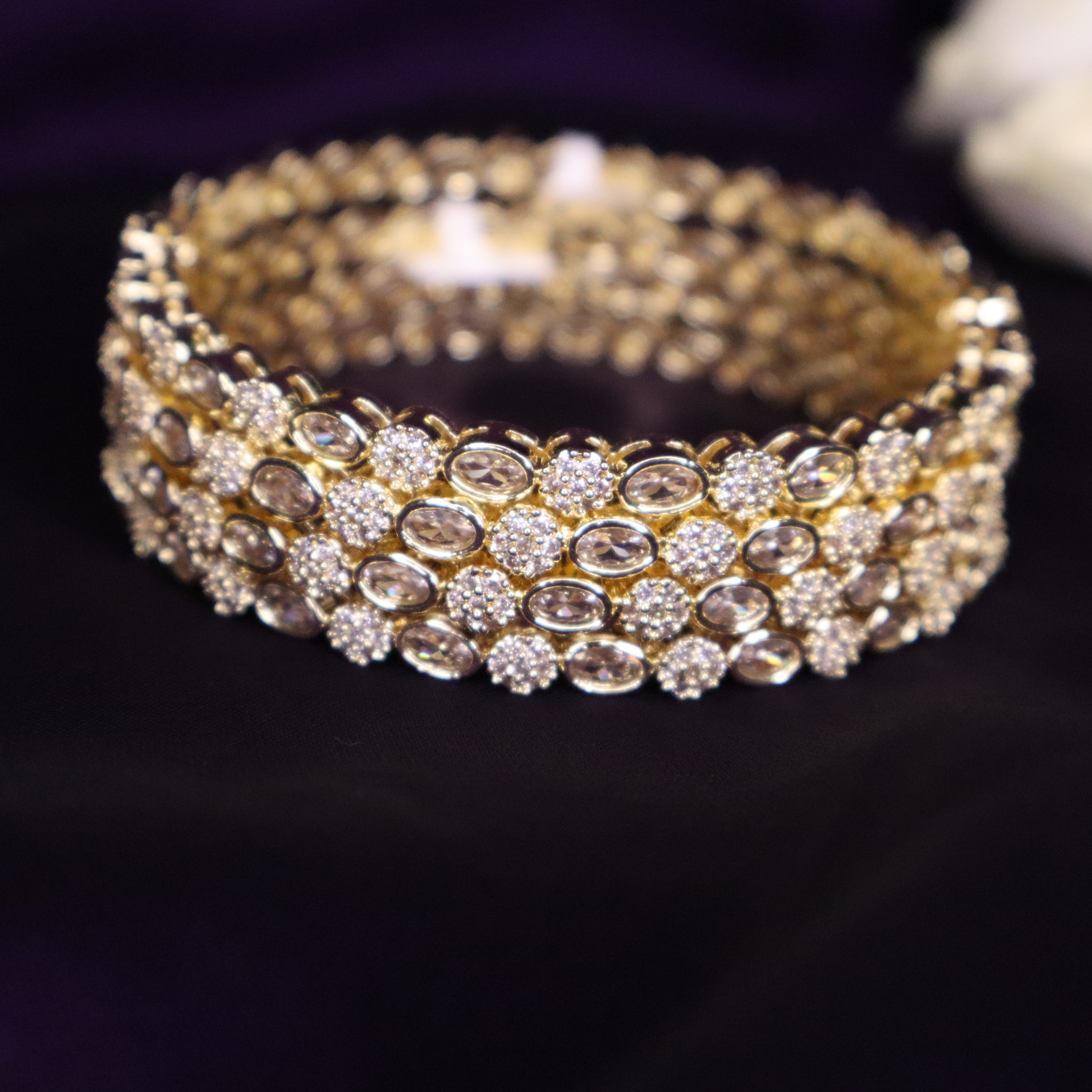 Stone embedded gold tone bangles