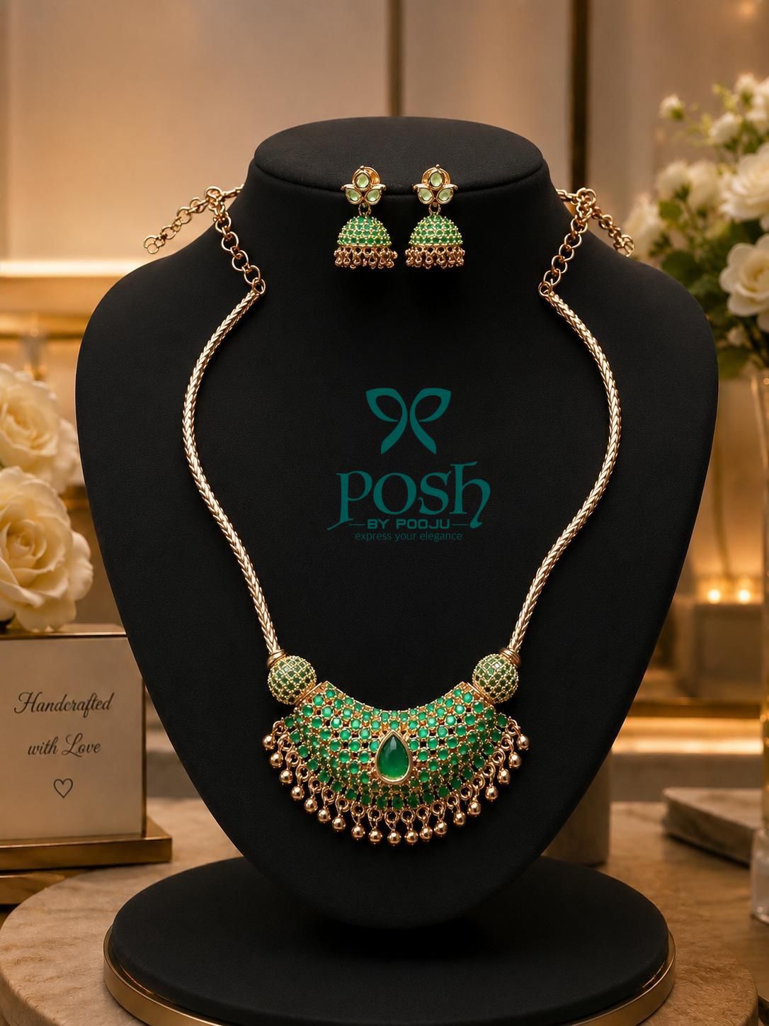 Statement neckpiece with matching jhumkas .- green