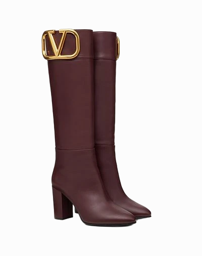 Botas altas de piel con hebilla dorada Valentino