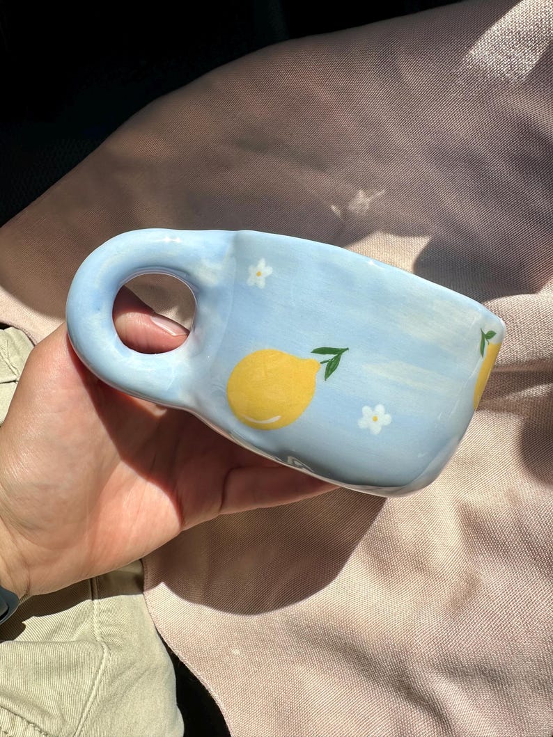 Handmade Ceramic Mug: Baby Blue Pottery Cup with Lemon Art