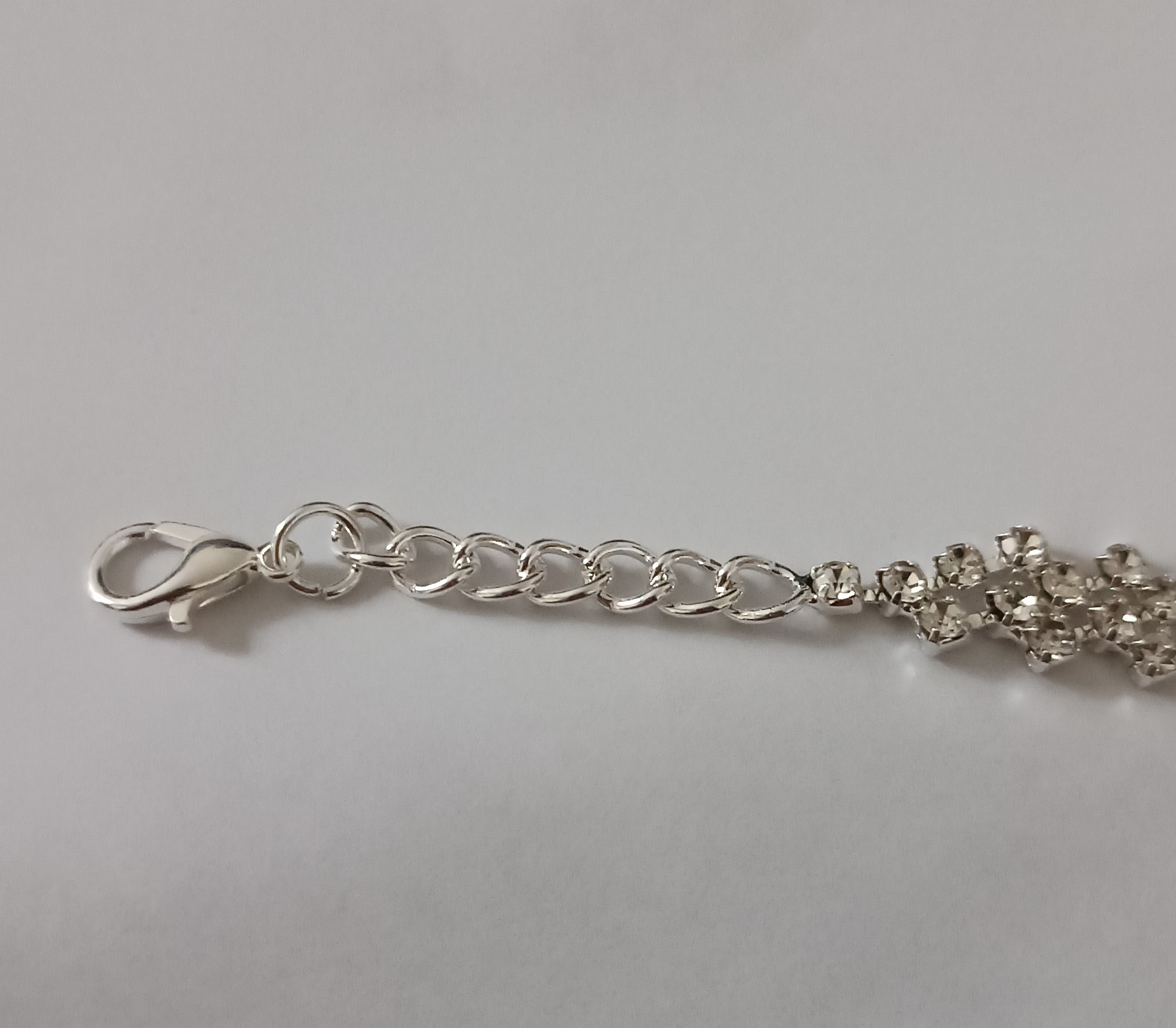 Bracelet chaîne argenté avec pendentif cœur et strass