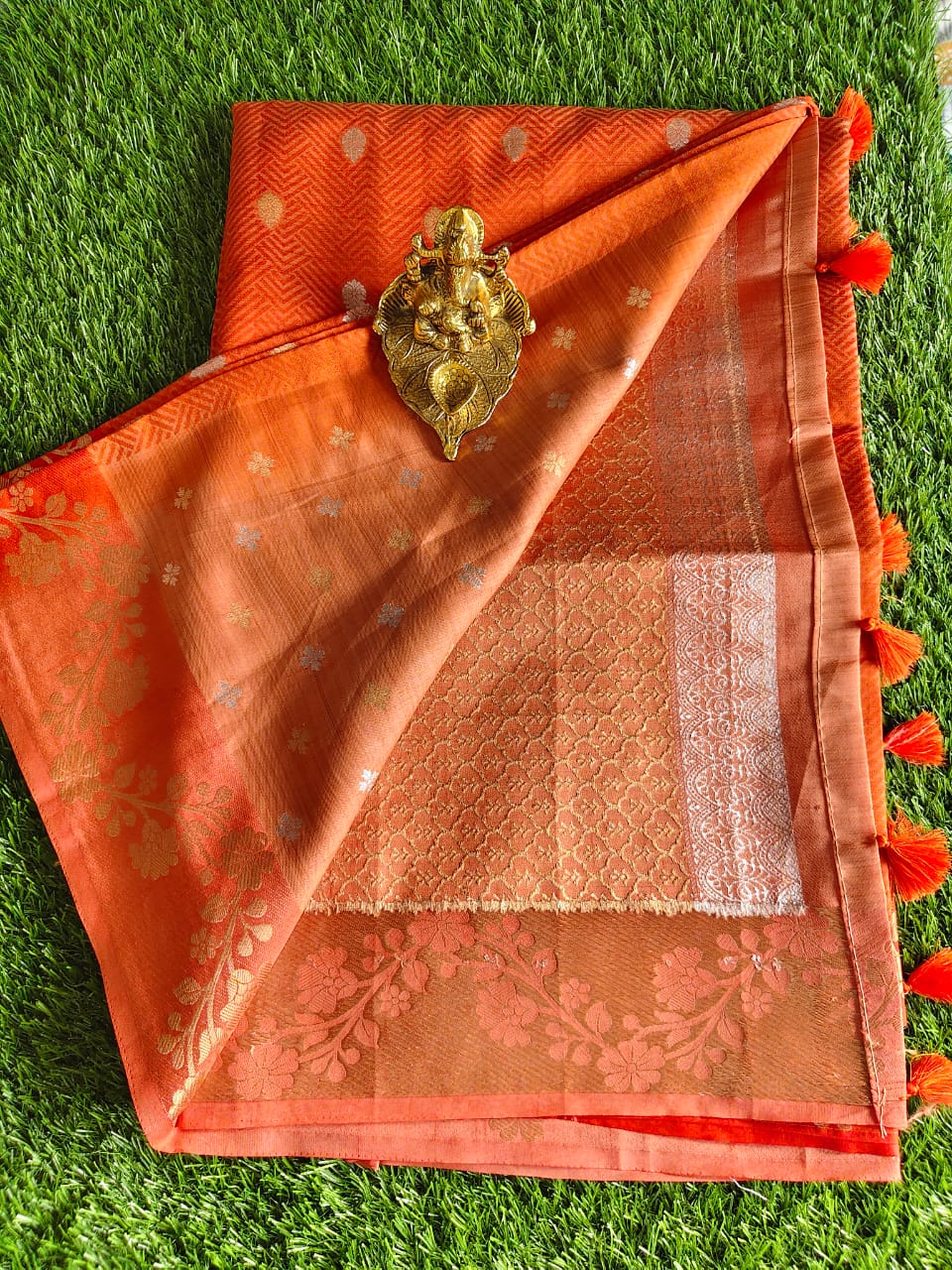 Orange Tussar Silk Saree with Allover Zari Buta Weaving and Floral Border