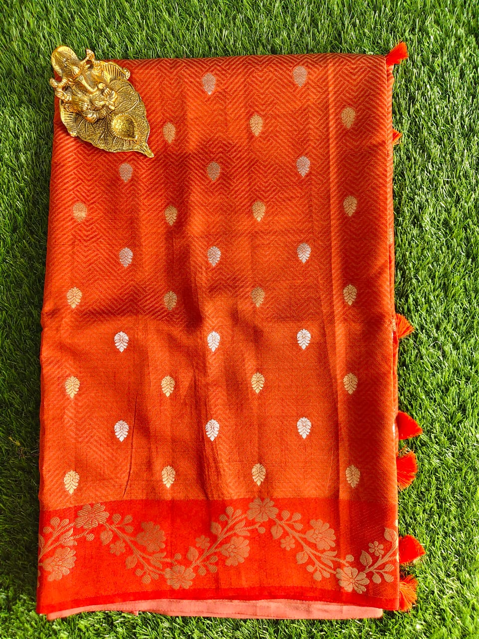 Orange Tussar Silk Saree with Allover Zari Buta Weaving and Floral Border