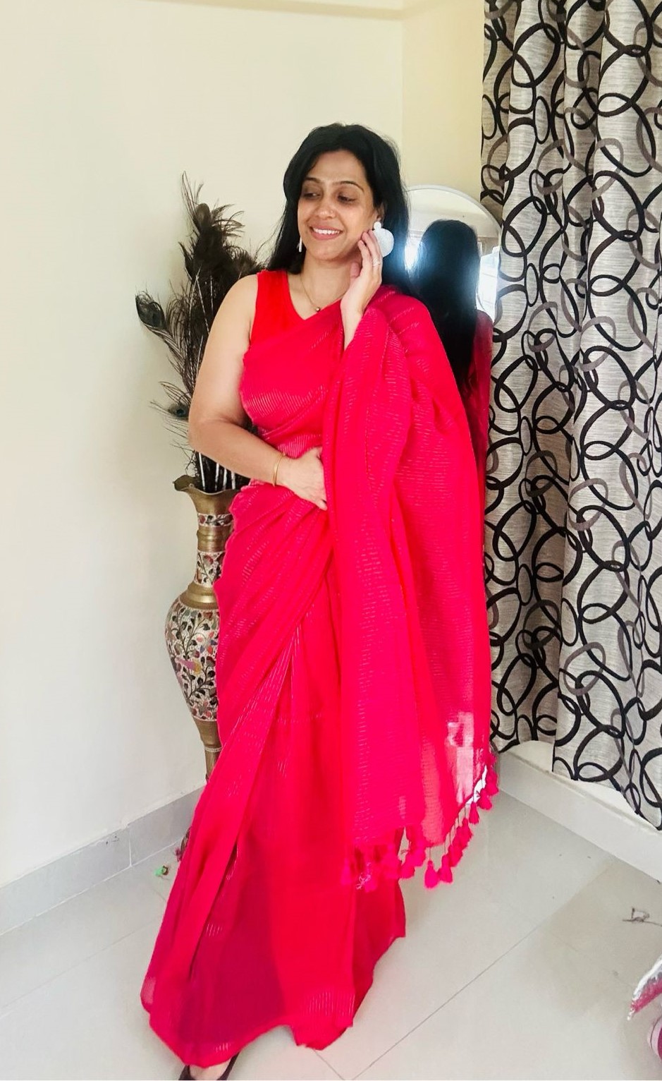 hot pink striped saree with tassel details