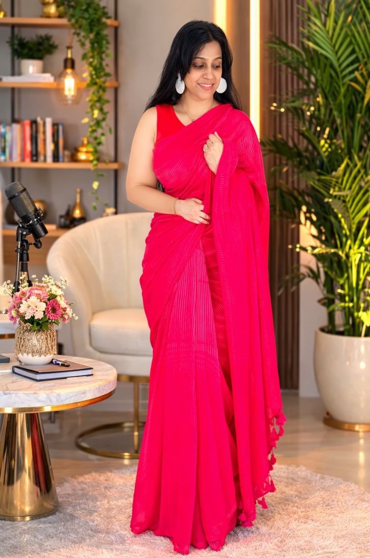 hot pink striped saree with tassel details