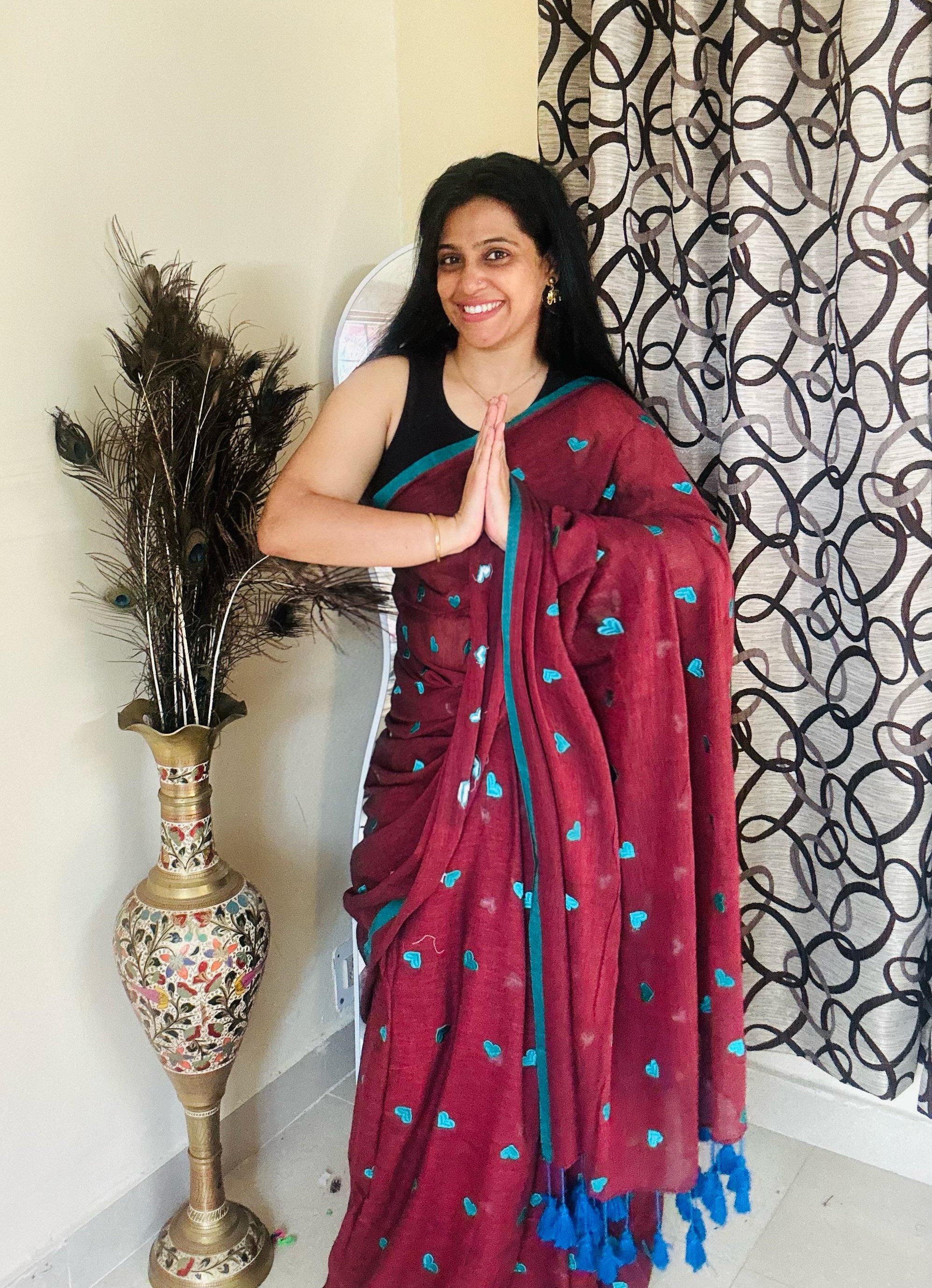 handcrafted cotton saree featuring embroidered heart motifs