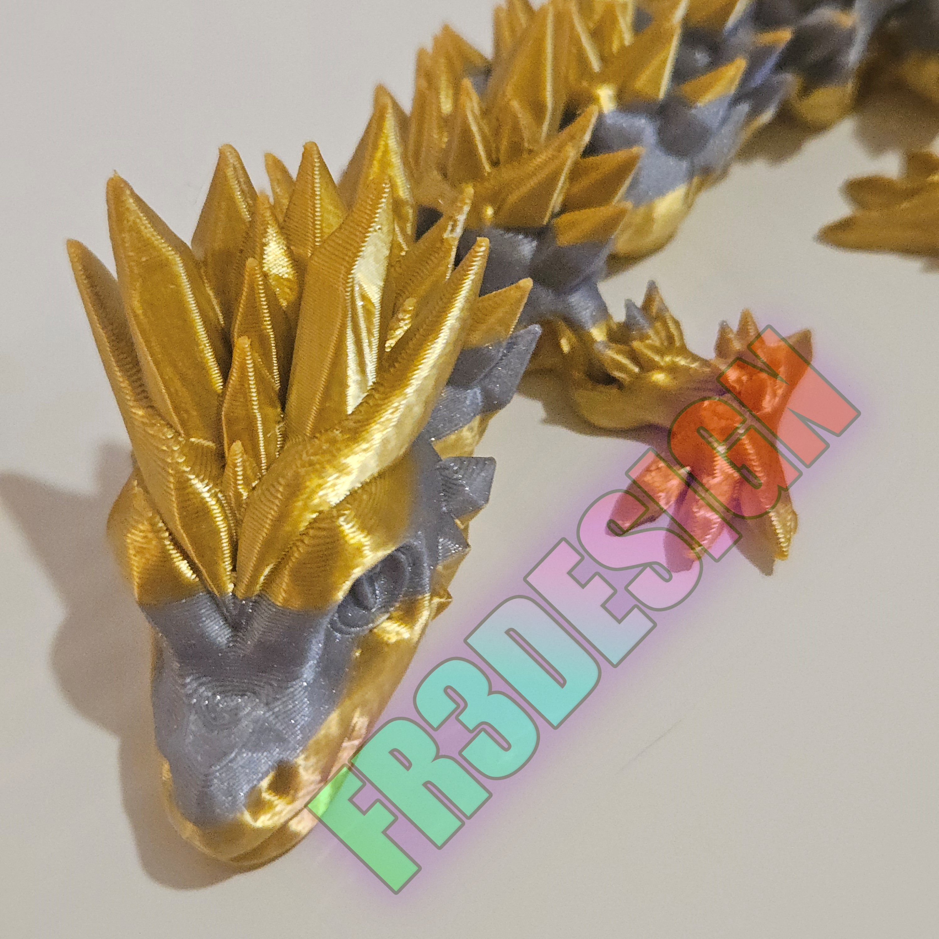 Dragon articulé doré et argenté