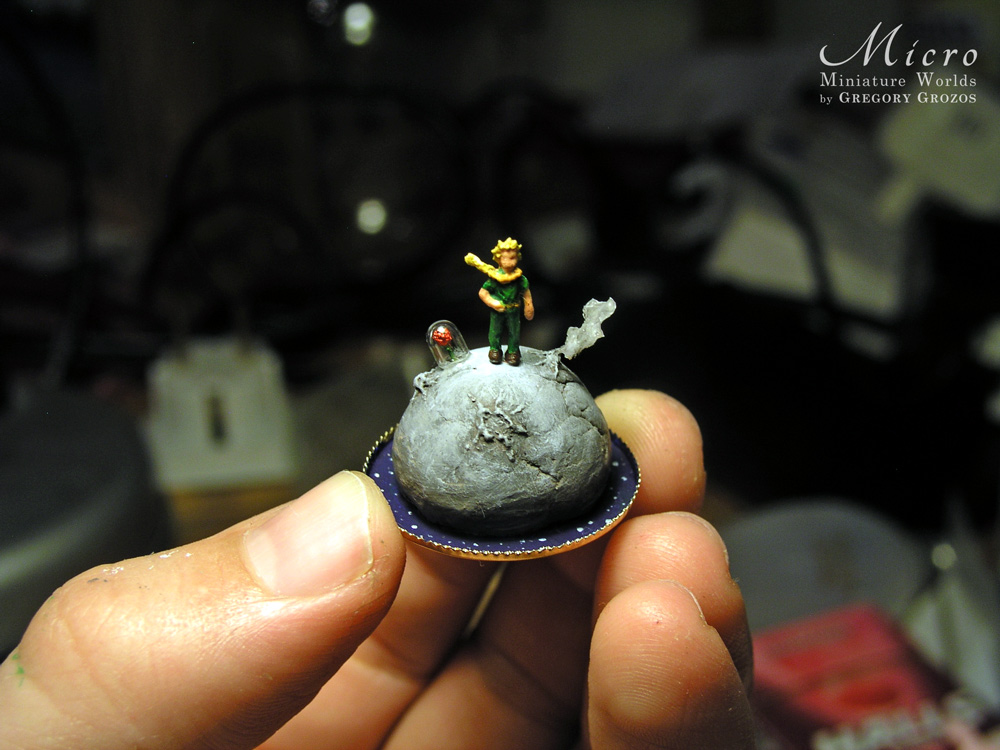 Miniature World - A little boy dressed in green is standing on a lonely planet