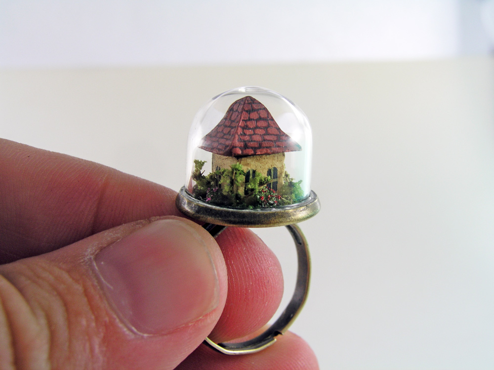 Miniature World jewellery. A tiny house inside a glass dome ring.