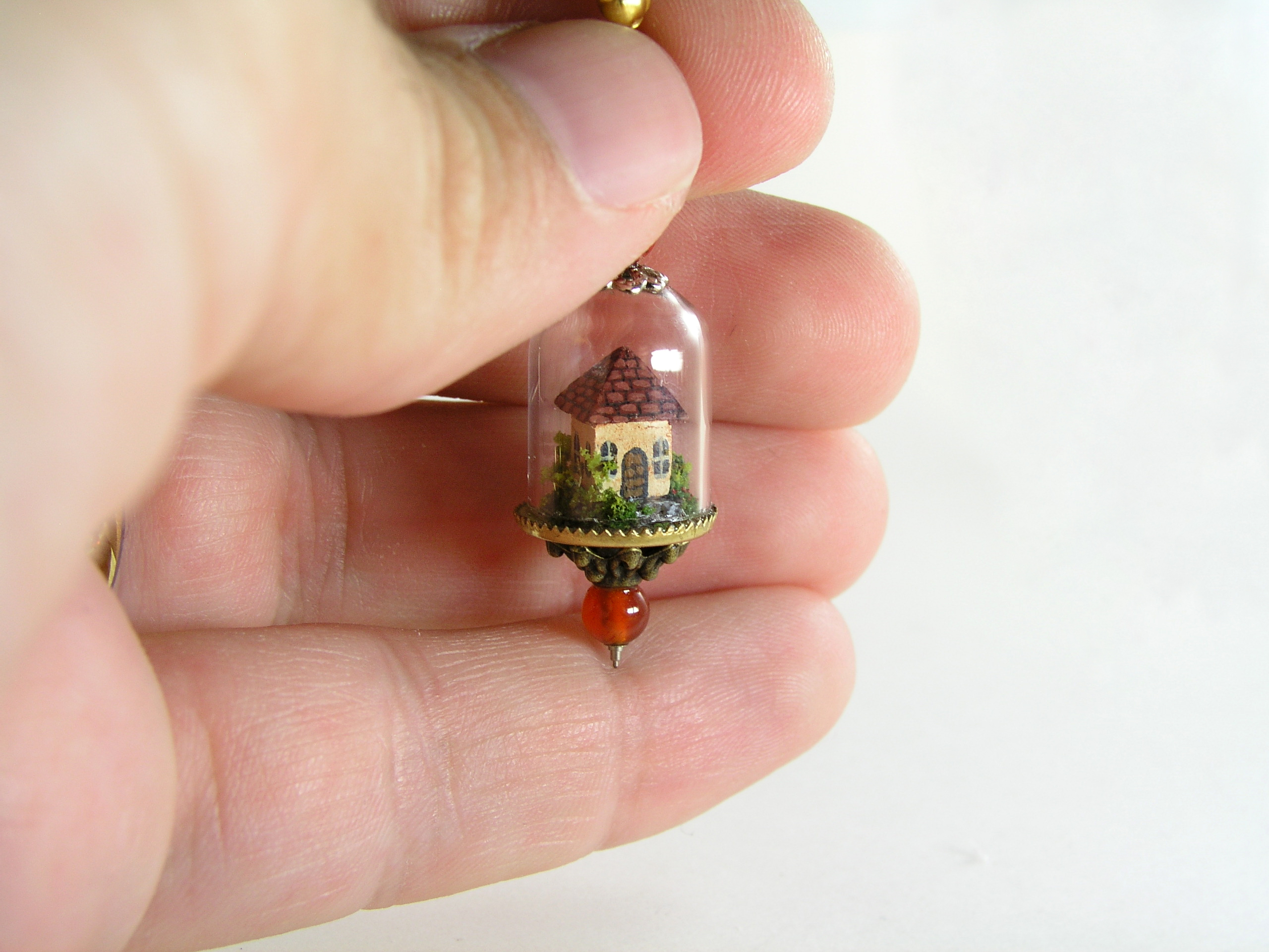 Miniature World earrings. Tiny houses surrounded by a garden.