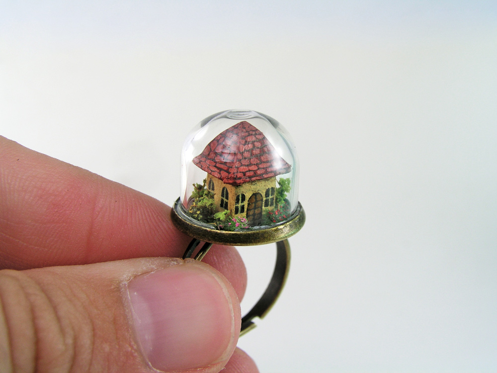 Miniature World jewellery. A tiny house inside a glass dome ring.