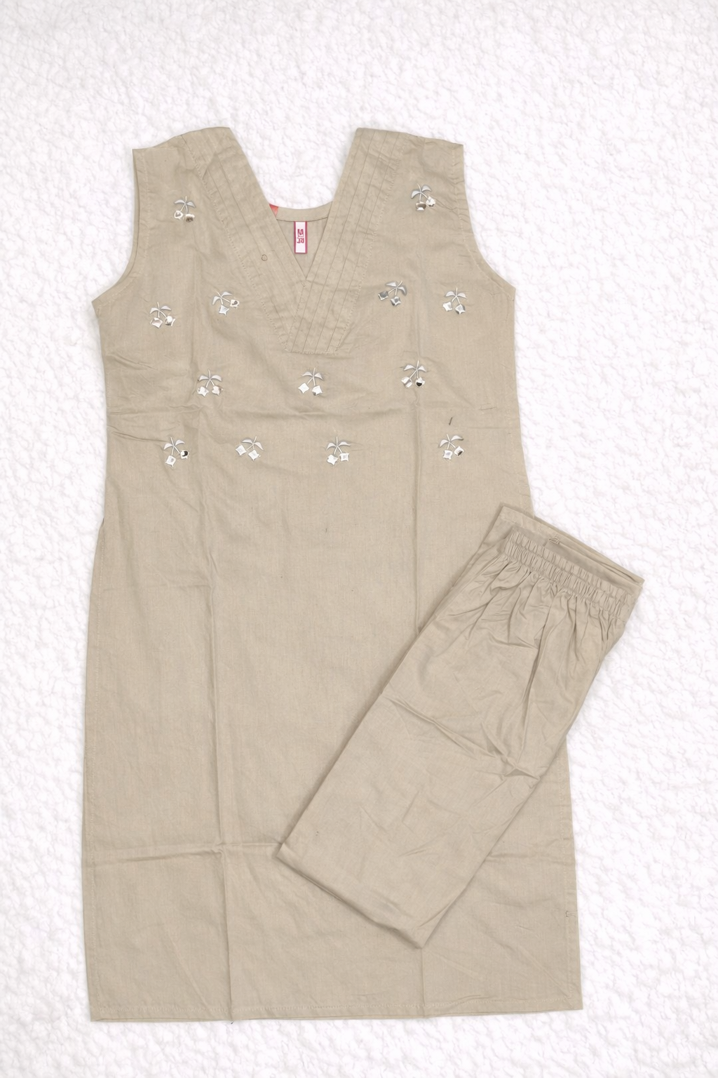 The Garment in the  image is a light grey colour .it is a natural, muted tone