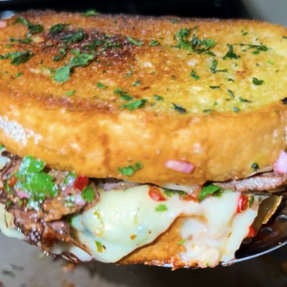 Gourmet steak, grilled cheese toast with chimichurri 