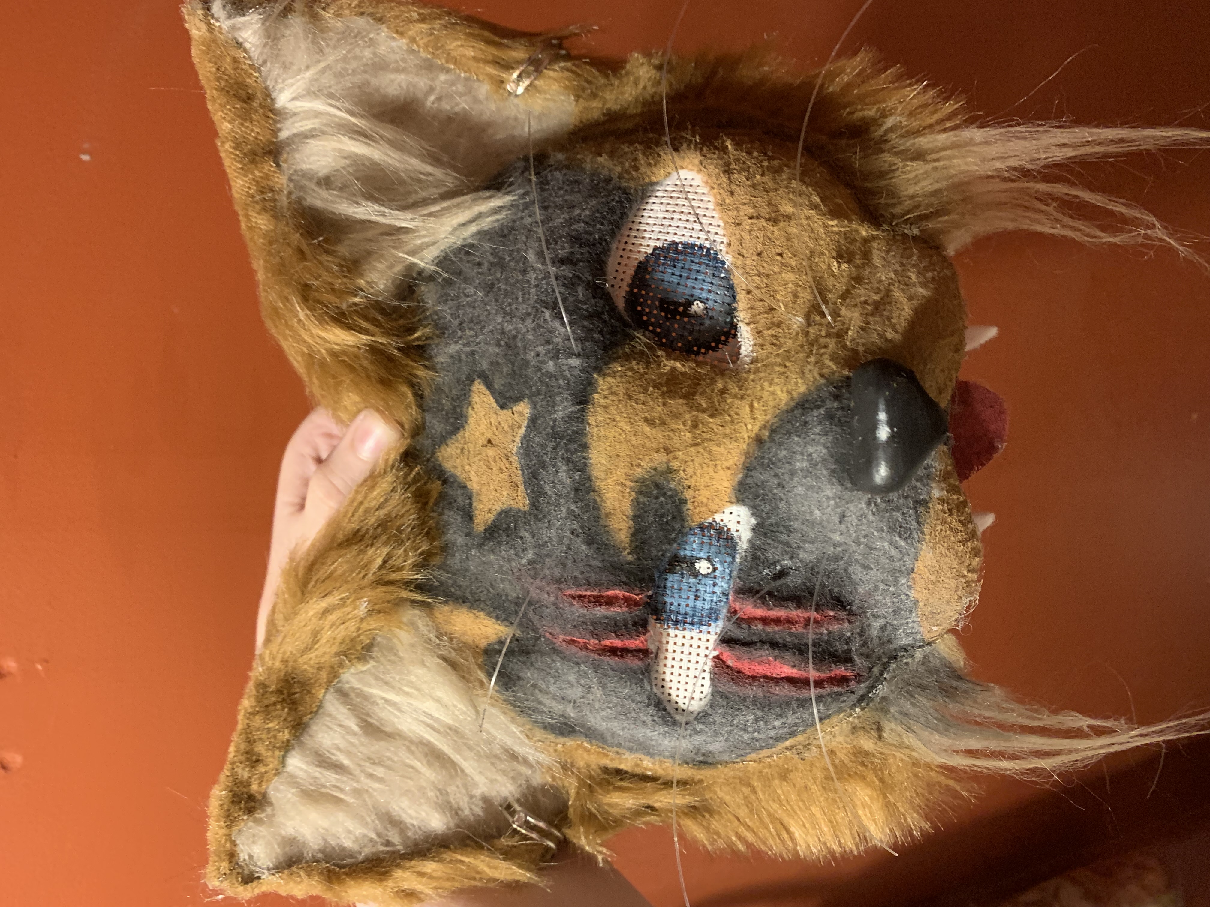 Pierce: black and brown cat mask