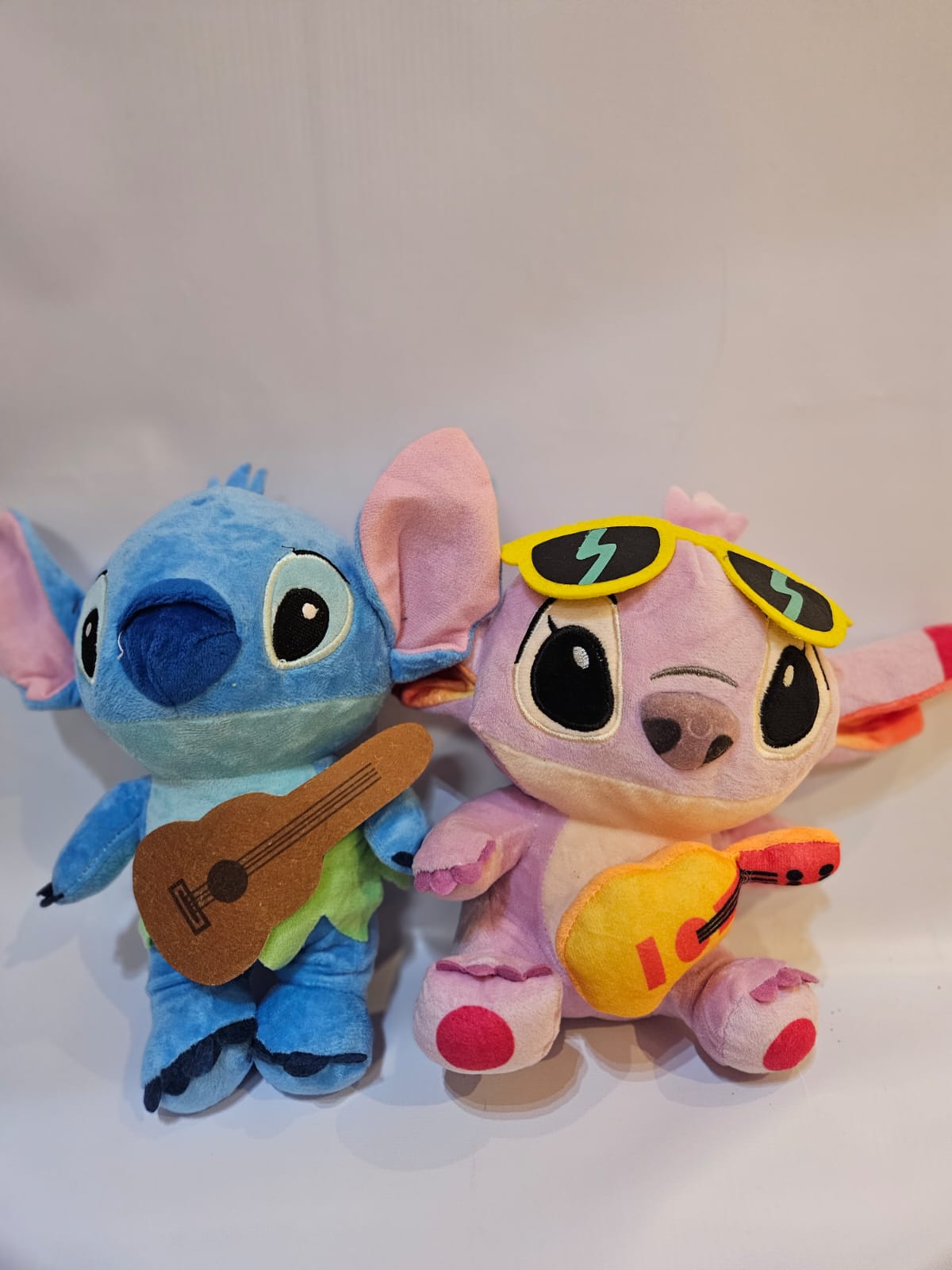 Pelúcias Stitch e Angel Musicais