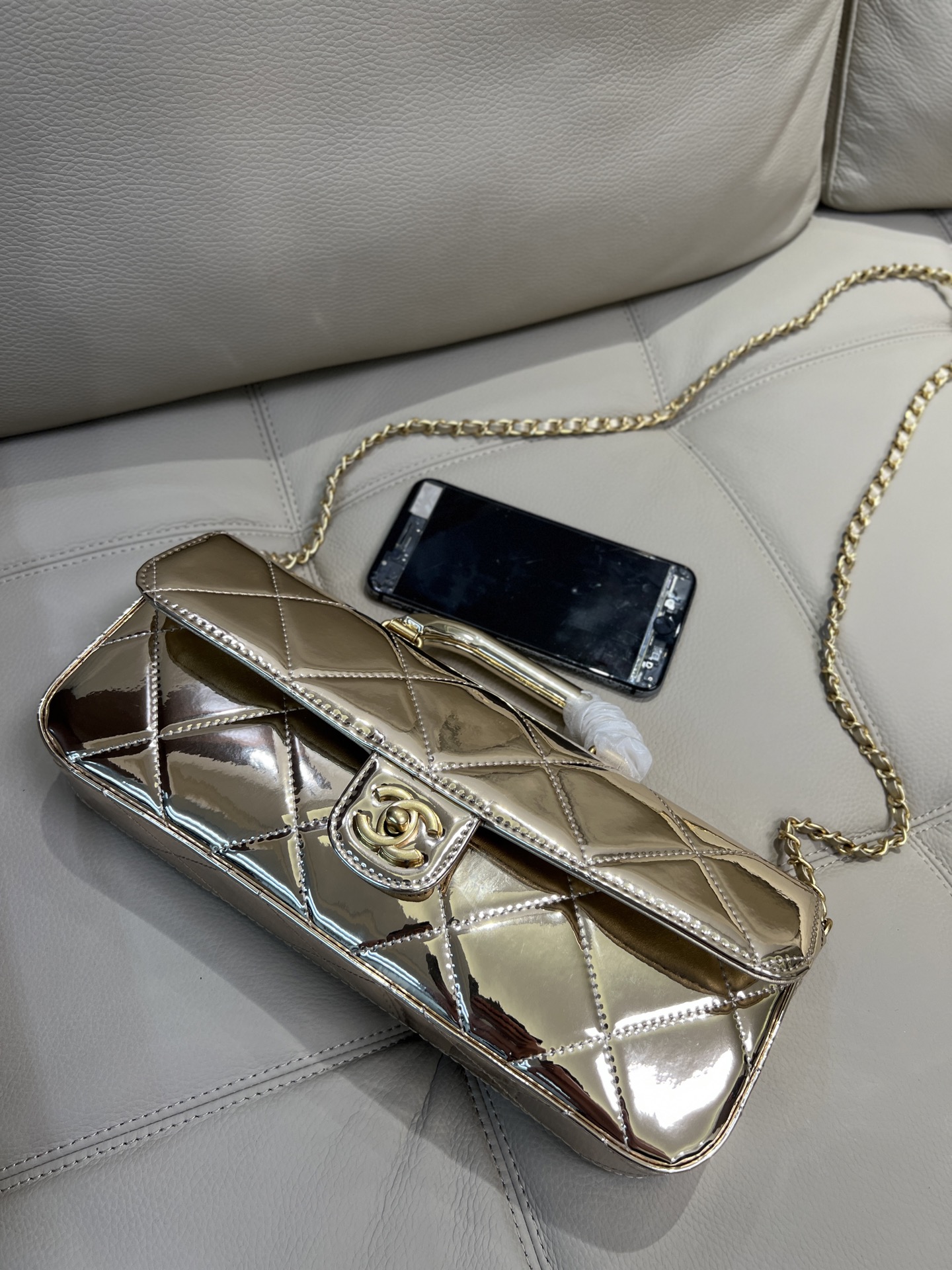 Chanel 25k flap bag, made of patent leather.