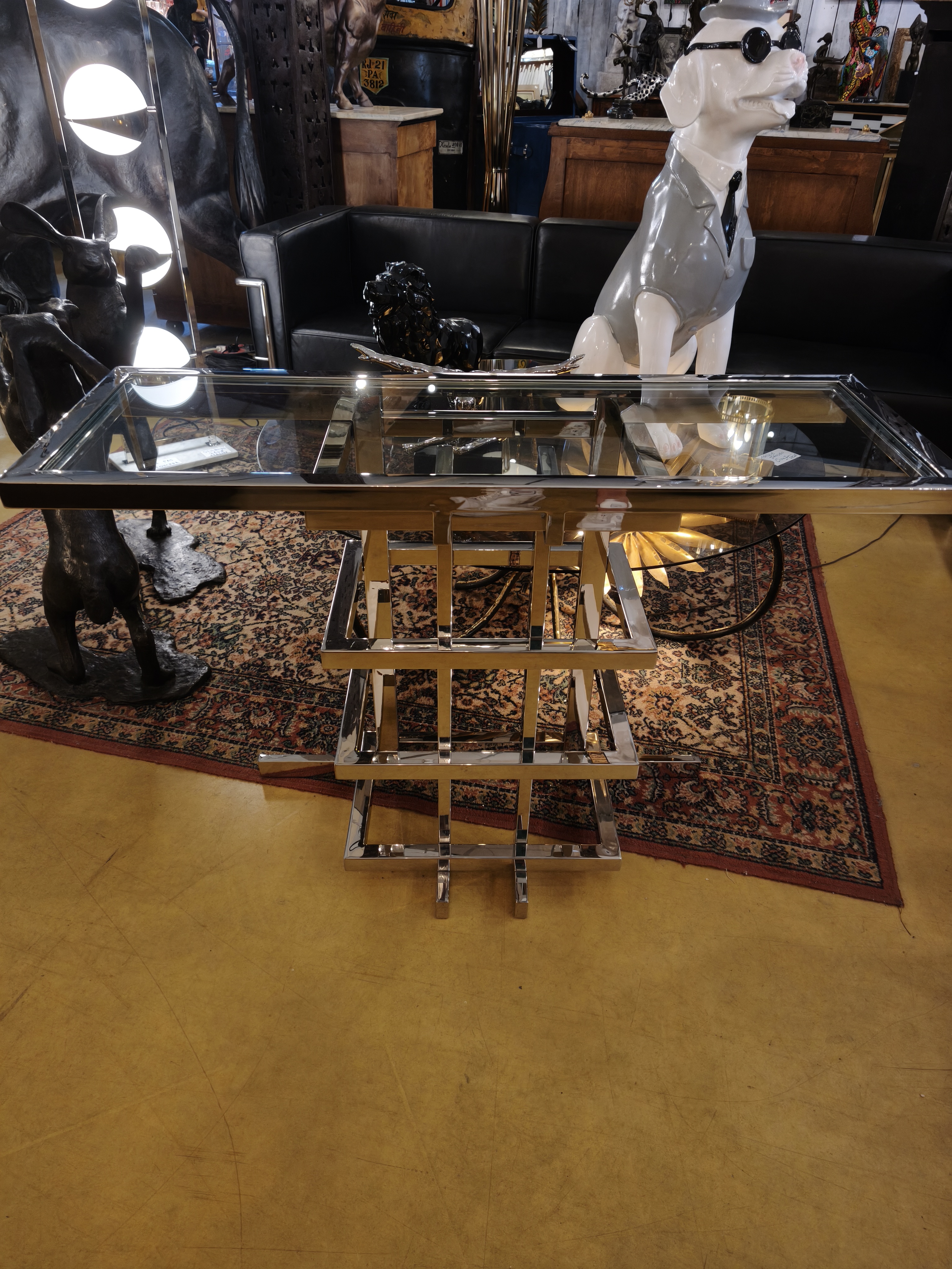 Console design en métal chromé et plateau en verre