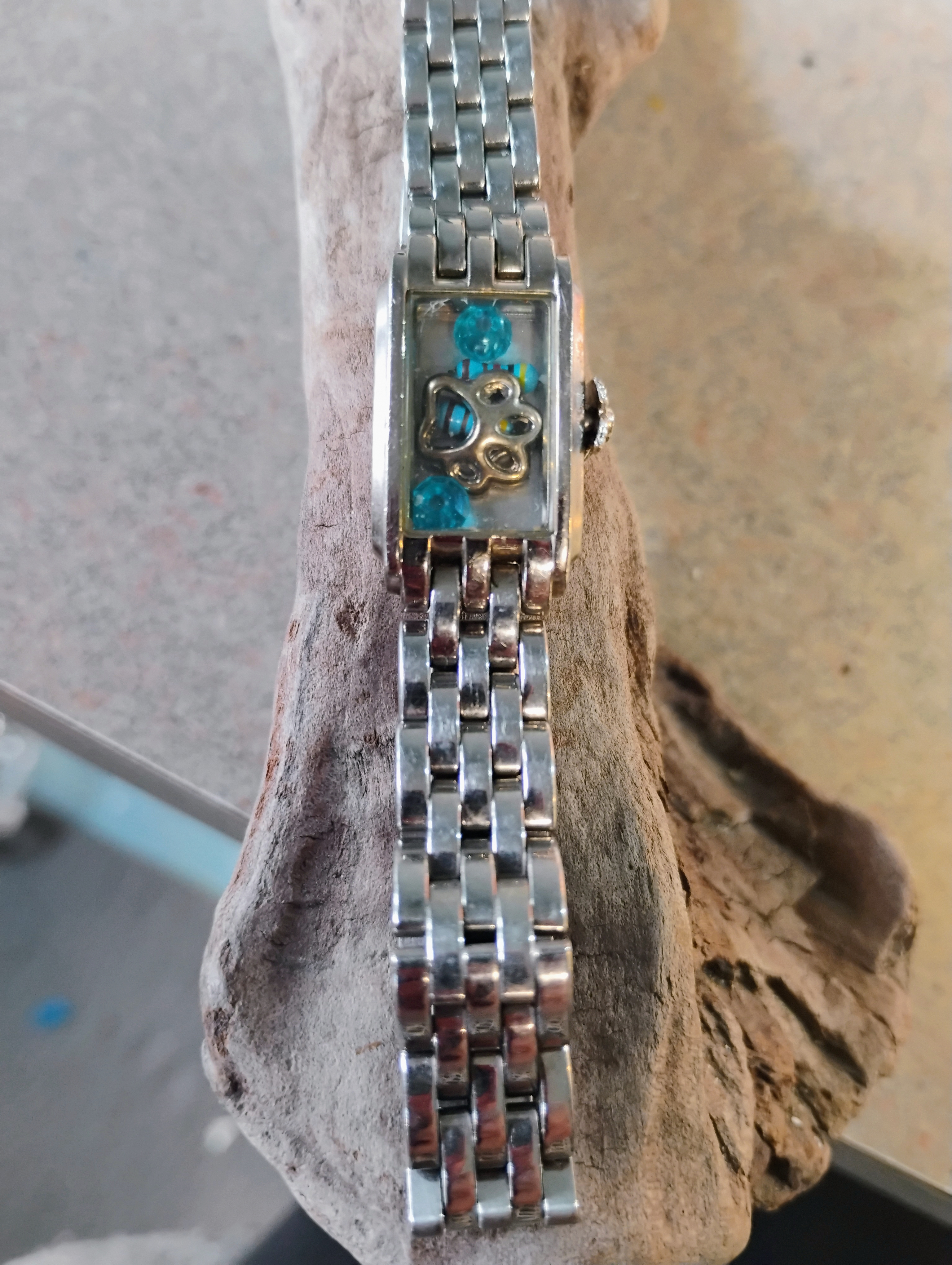 Silver toned Bracelet Watch with Blue Gems and a paw