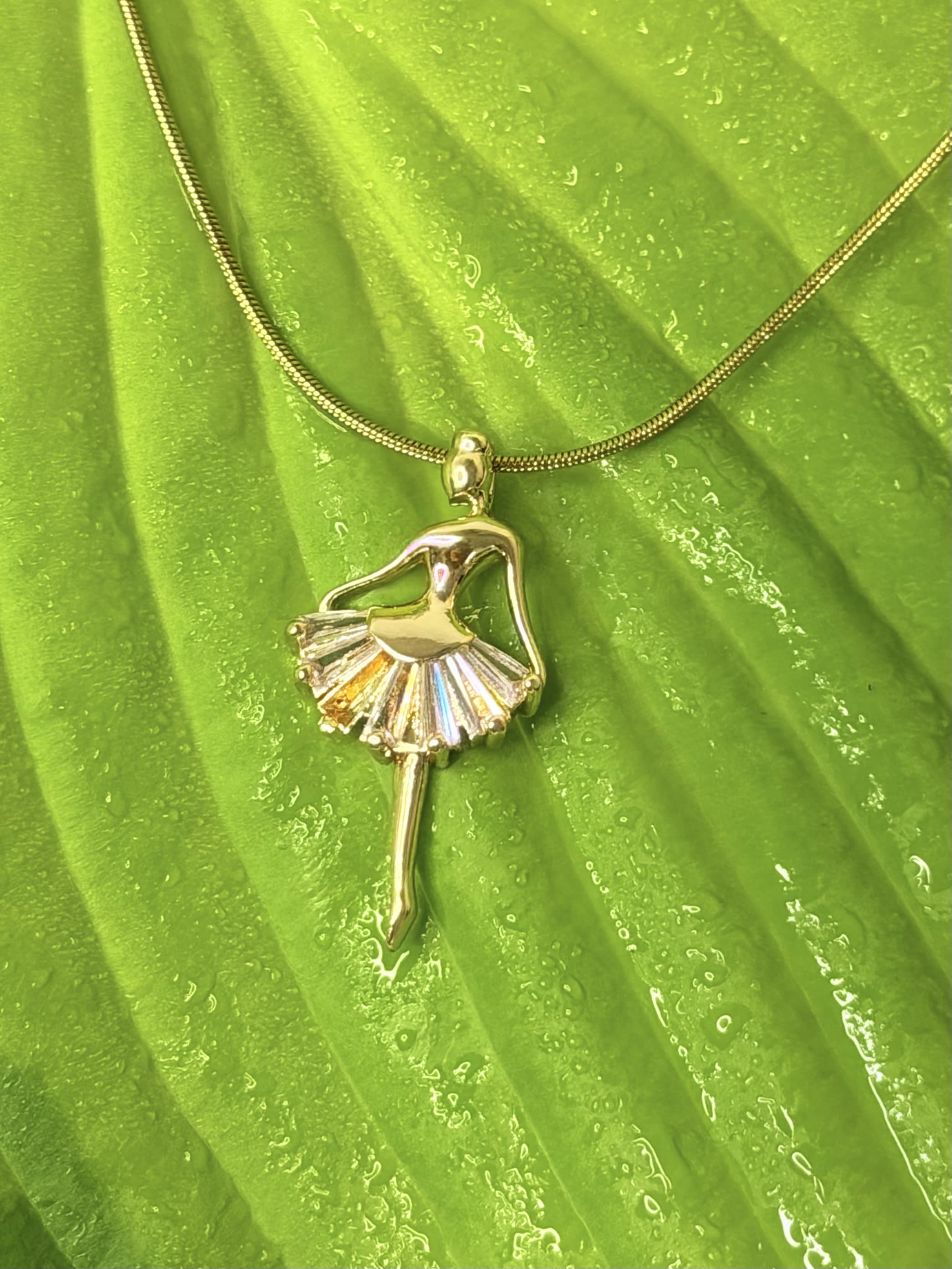 THE EVERGLOW BALLERINA NECKLACE