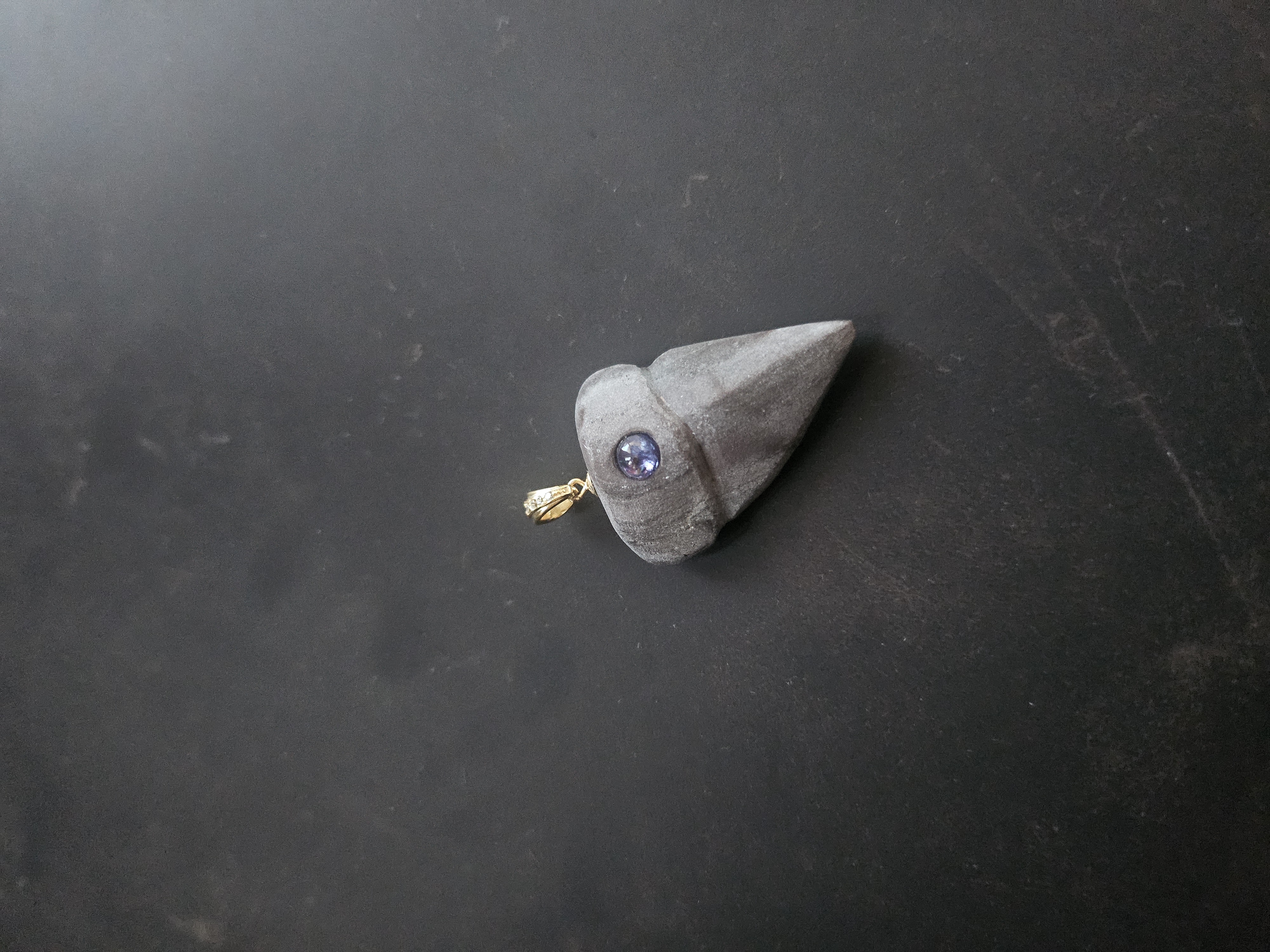 Carved Bonneville Stone Shark Tooth · Tanzanite Pendant