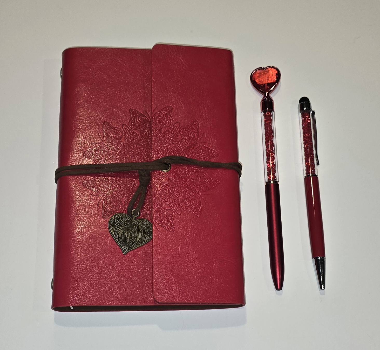 Leather bound journal and 2 decorative pens