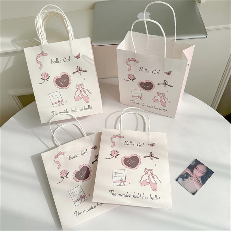 Chic pink printed paper gift bag with handle