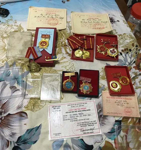 Original Vietcong 1975-1995 10 Medals Original Set of 10 medals and 4 Vietcong document 1975-1995 