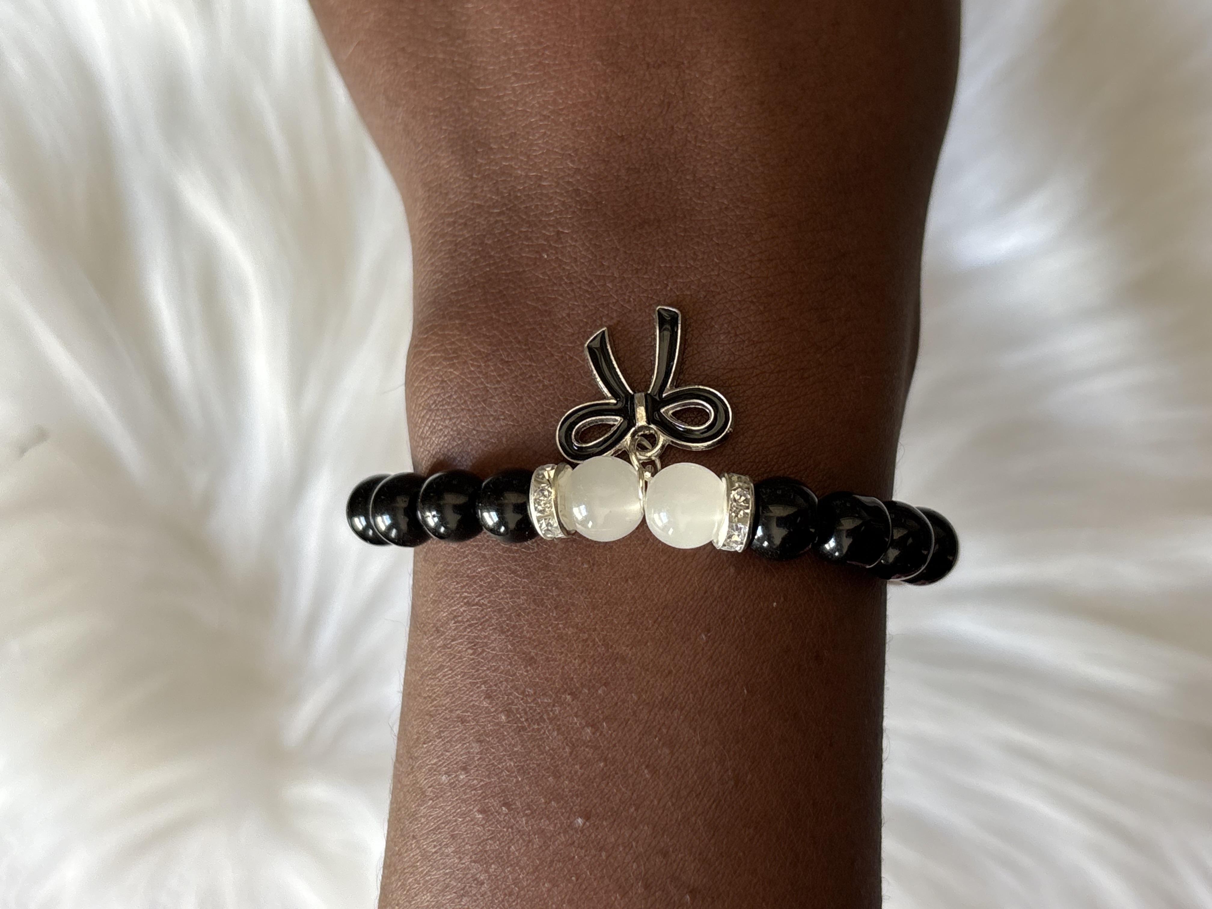 Black Bead Bracelet with Bow Charm