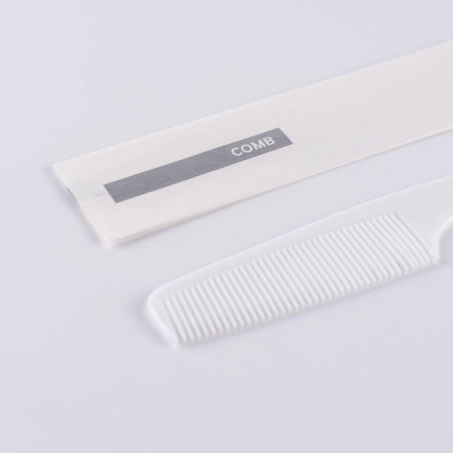 Plastic comb 7" in white pouch 