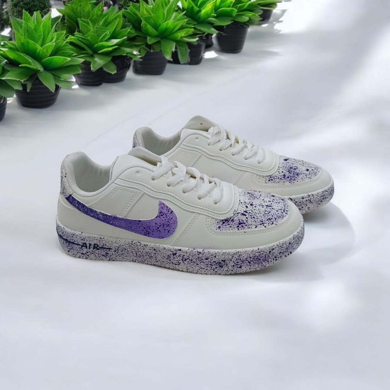 White Sneakers with Purple Splash