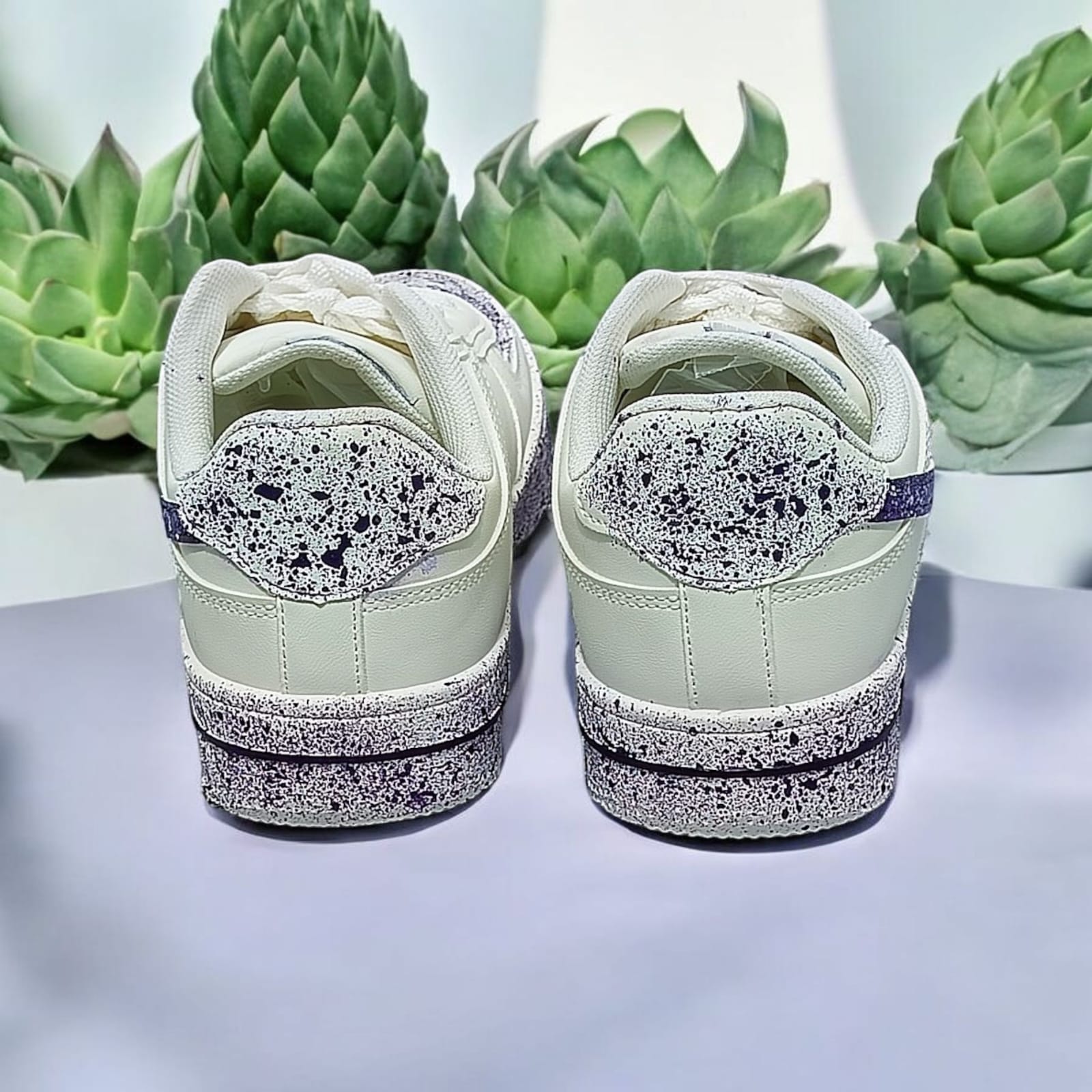 White Sneakers with Purple Splash