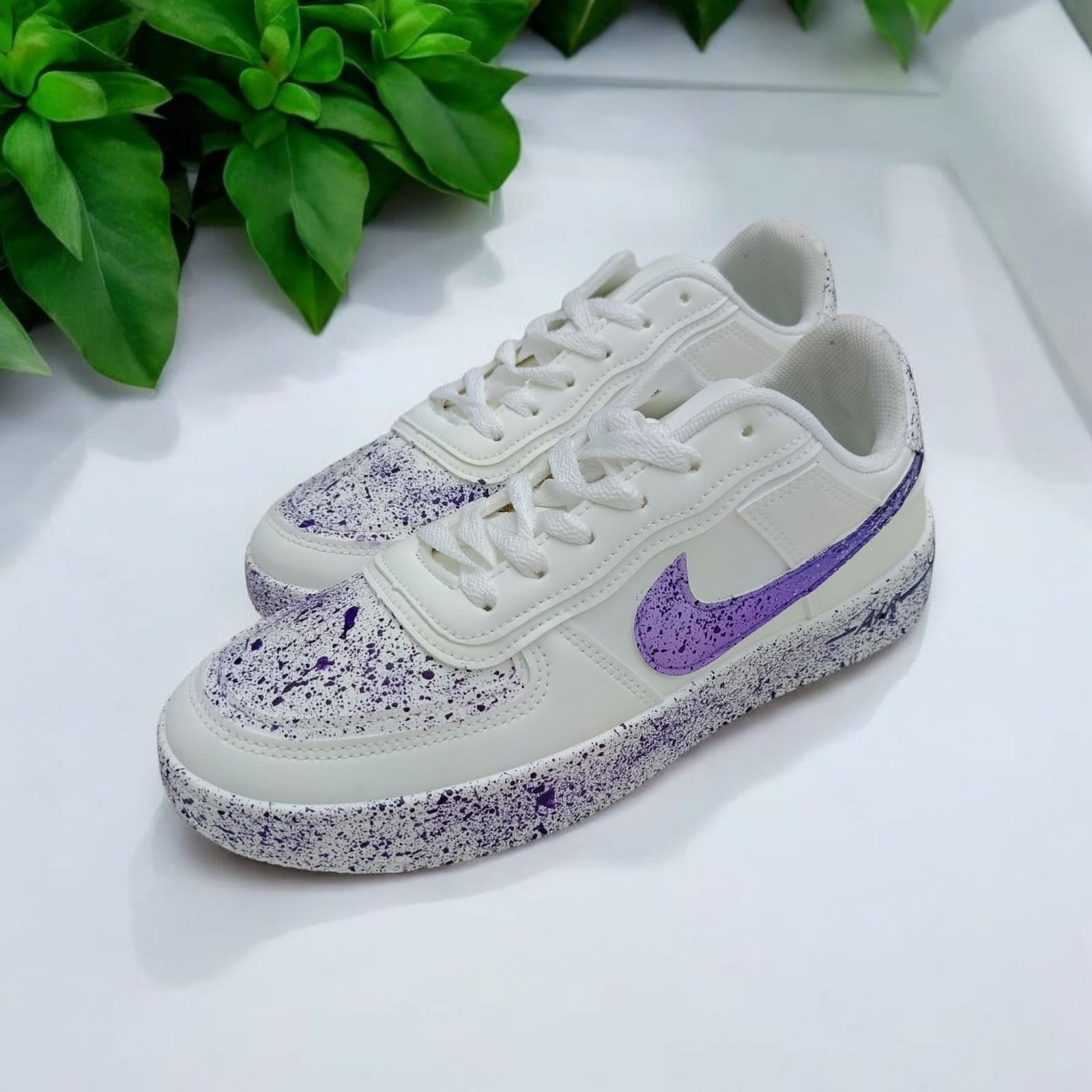 White Sneakers with Purple Splash