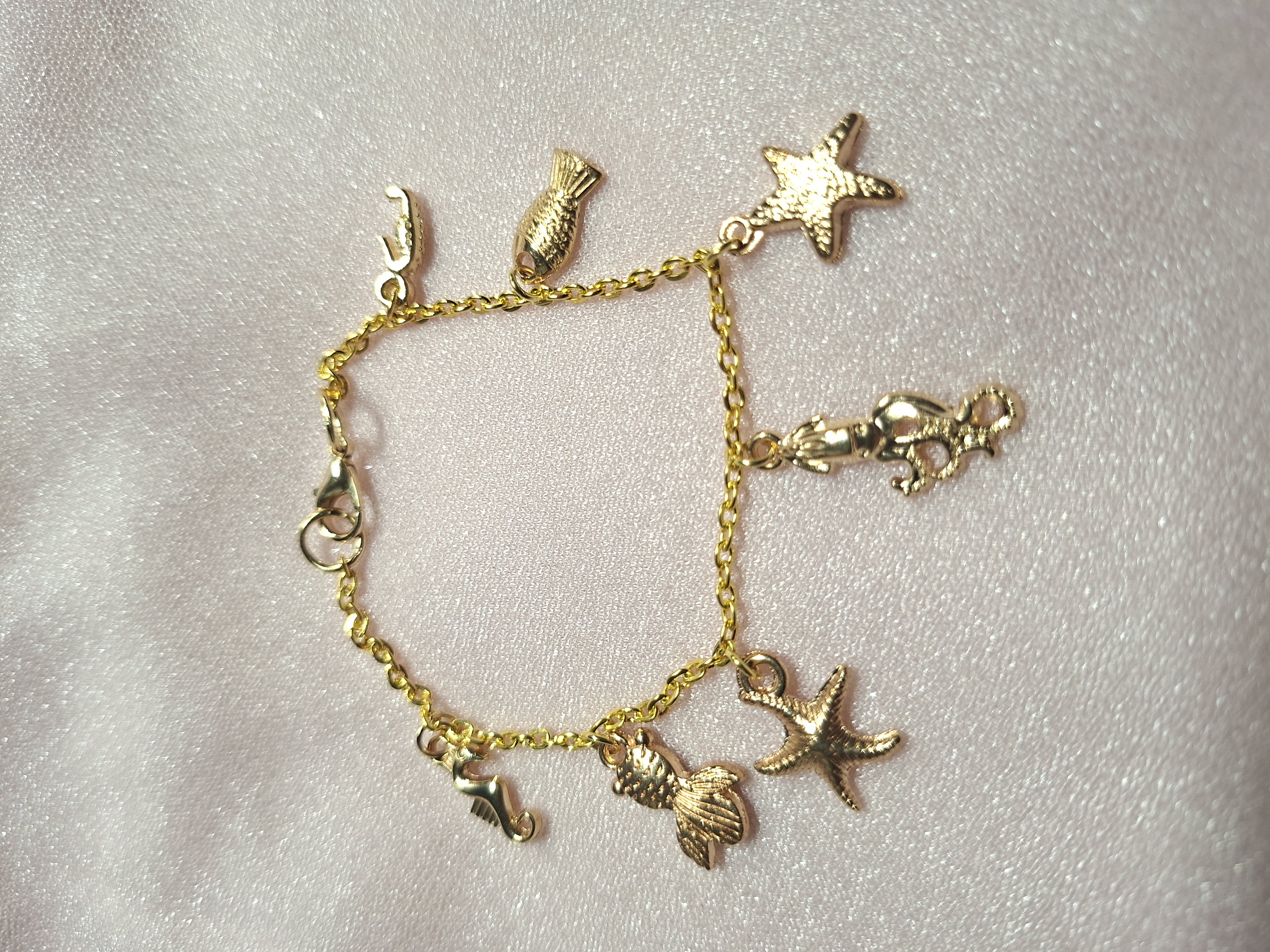 Bracelet 7 Breloques Or