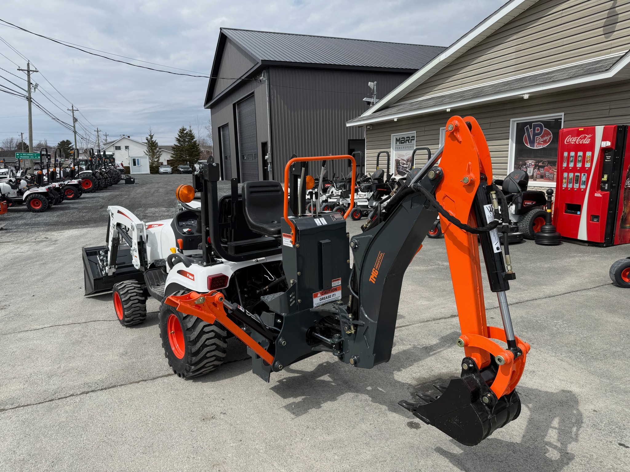 Compact Tractor with Backhoe Attachment
