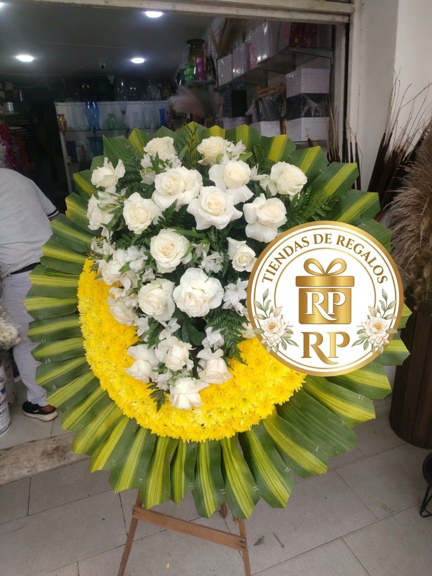 Corona fúnebre de flores blancas y amarillas