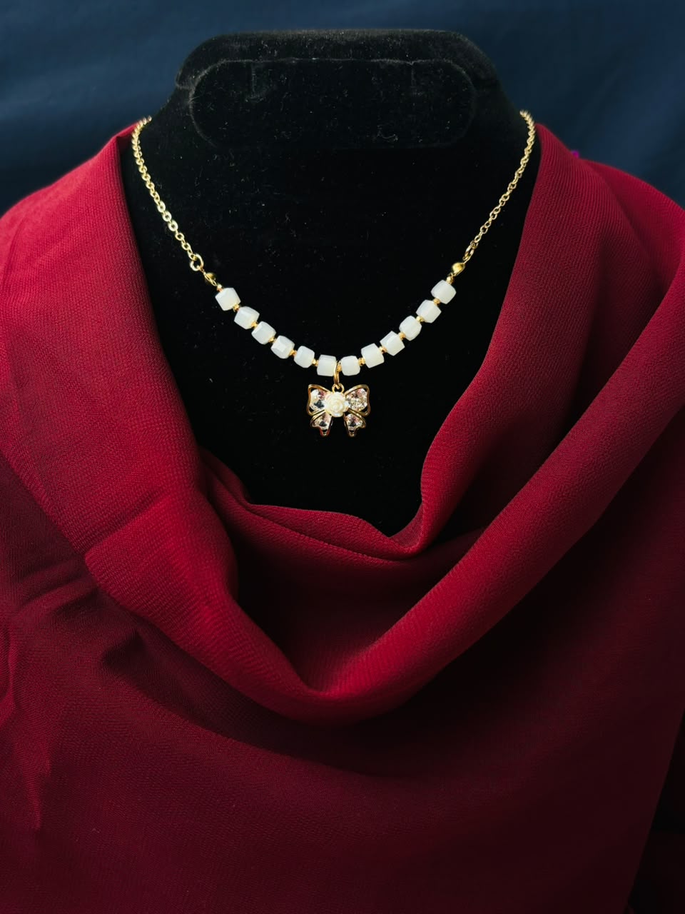 Elegant Bow with Pearl Bead Pendant 