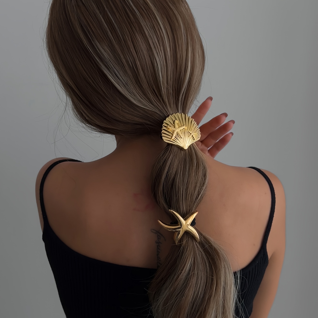 ربطات شعر ذهبية بتصميم بحري